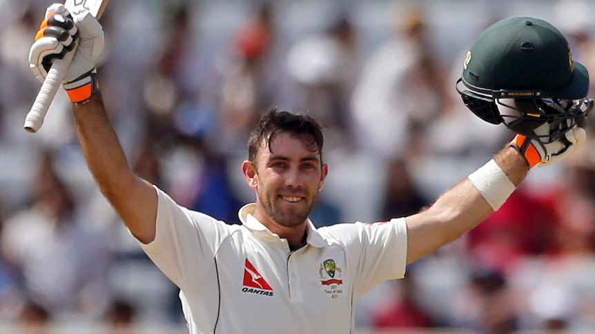 Glenn Maxwell, arms aloft, celebrates his ton