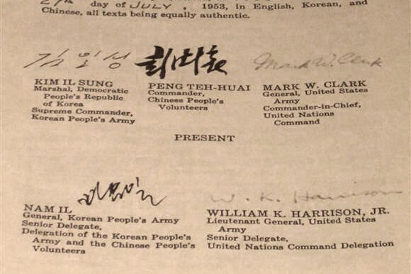 Photo of the English text of the Korean Armistice Agreement, with signatures at the bottom.