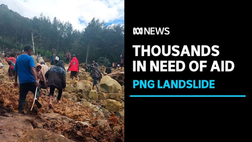 Thousands in Need of Aid, PNG Landslide: People with their backs to camera walk over rubble and rocks. 