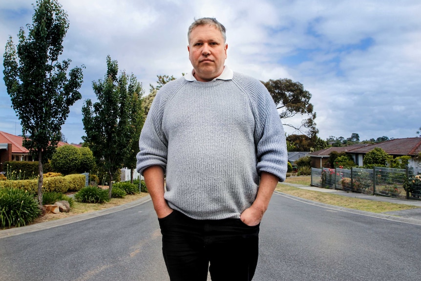 Mark James stands out on a street near his eastern suburbs home in Melbourne.