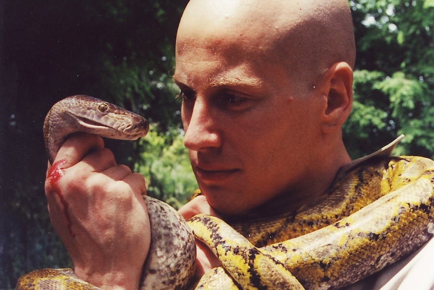 Dr Bryan Grieg Fry with snake
