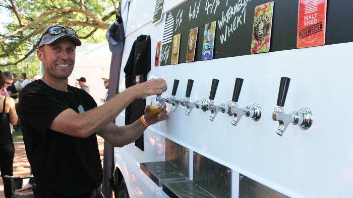 Andrew Bett pours a beer at the Great Australian Beer Festival in Albury