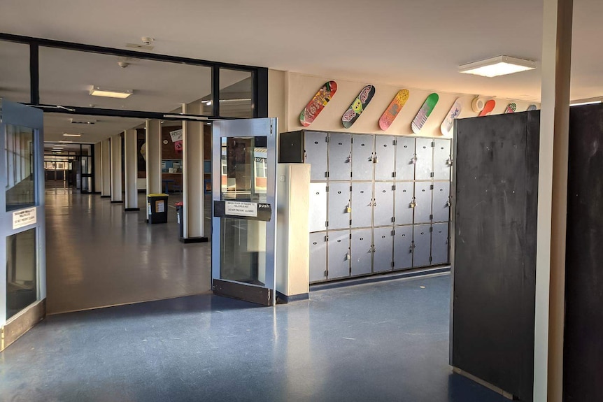 An empty school corridor shows no children.