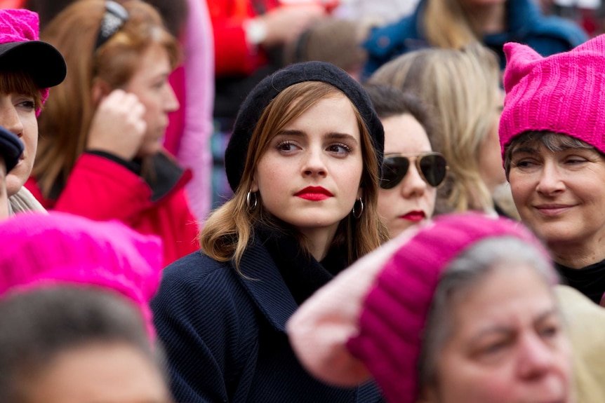 Actress Emma Watson surrounded by other women pictured in a story about self-partnering.