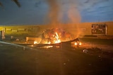 A burning vehicle at the Baghdad International Airport following an air strike by the US in Baghdad.