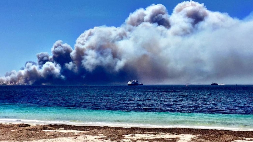 Smoke billows over ships off the Esperance coast.