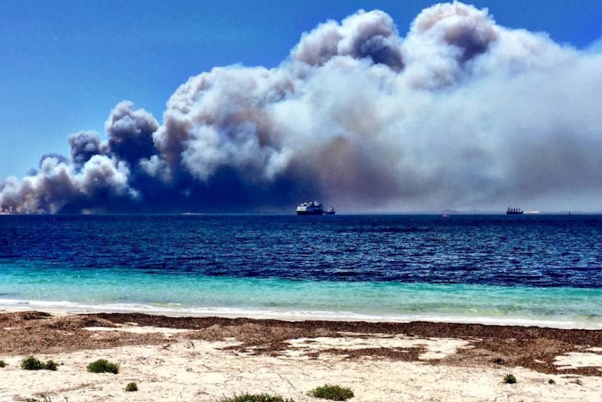 Smoke billows over ships off the Esperance coast.