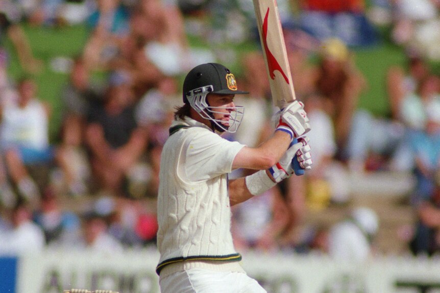 Australian cricketer Mark Waugh completes a stroke in an Ashes Test against England at Adelaide.