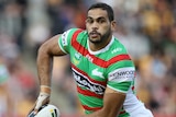 Greg Inglis shapes to pass a ball