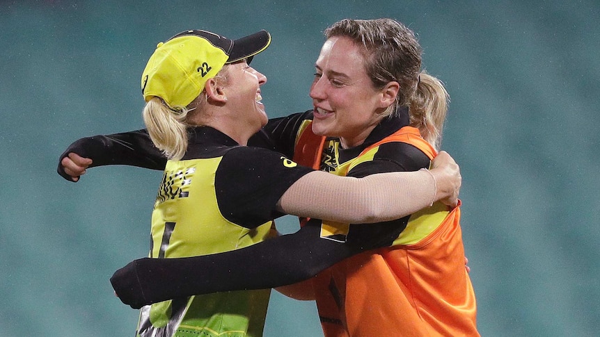 Delissa Kimmince (left) hugs injured teammate Ellyse Perry after the Twenty20 World Cup semi-final against South Africa.