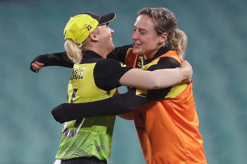 Delissa Kimmince (left) hugs injured teammate Ellyse Perry after the Twenty20 World Cup semi-final against South Africa.