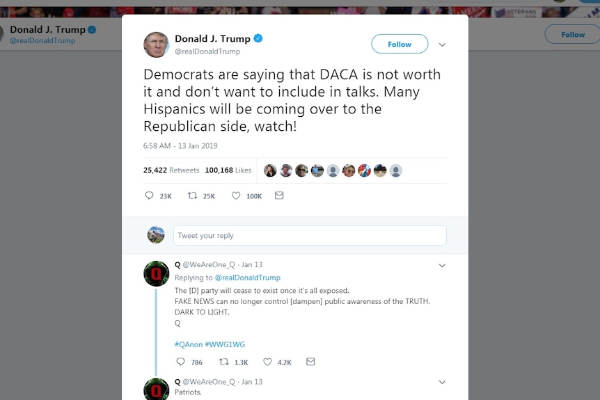 A screenshot of a Donald Trump tweet about immigration with a reply from a group called QAnon.