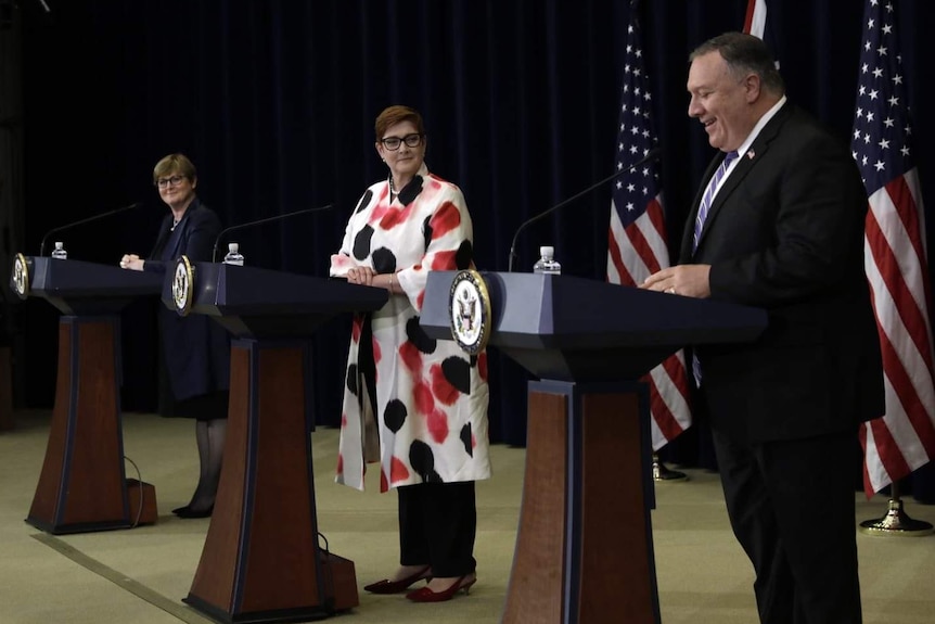 Linda Reynolds, Marise Payne and Mike Pompeo stand at lecterns at a press conference