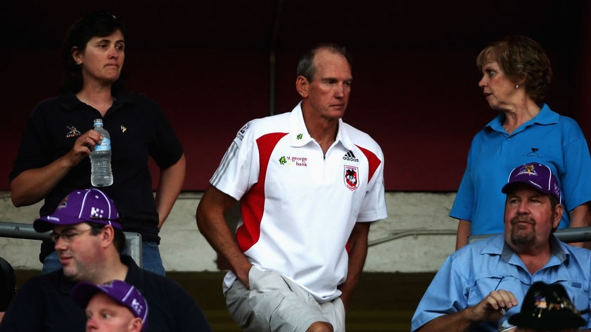 Wayne Bennett makes his way to the coaches' box