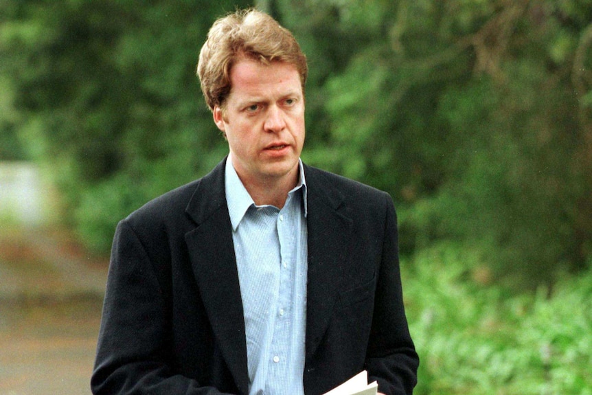 Earl Spencer looks distraught as he speaks to the media following the death of his sister