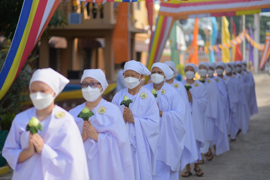 Women in white garments.