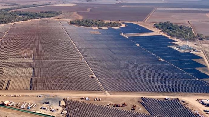 An image from the air of a huge solar farm, with hundreds of panels