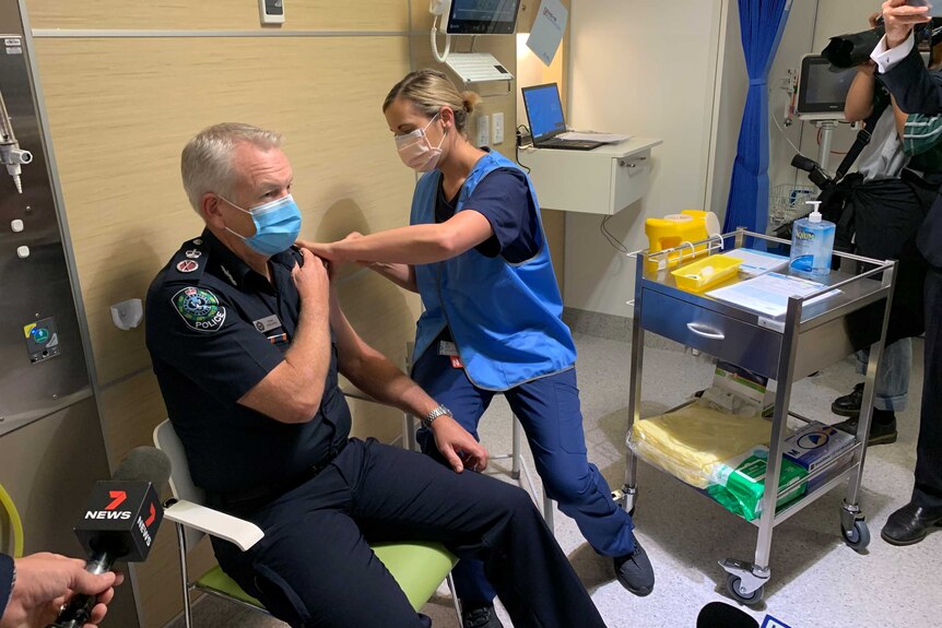 SA Police Commissioner Grant Stevens receiving a vaccination