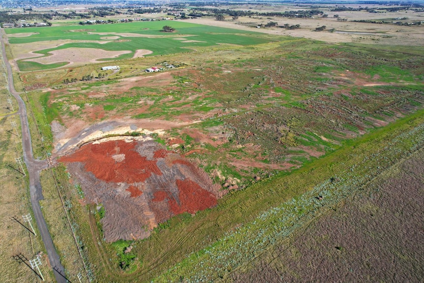 A bird's-eye view of land with soil built up covering the property