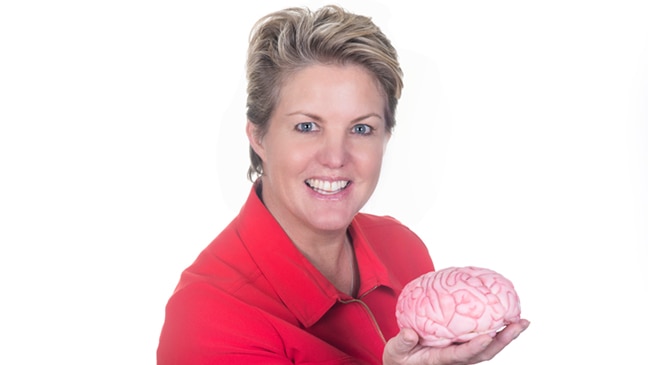Neurobranding expert Lauren Clemetts holding a pink fake brain