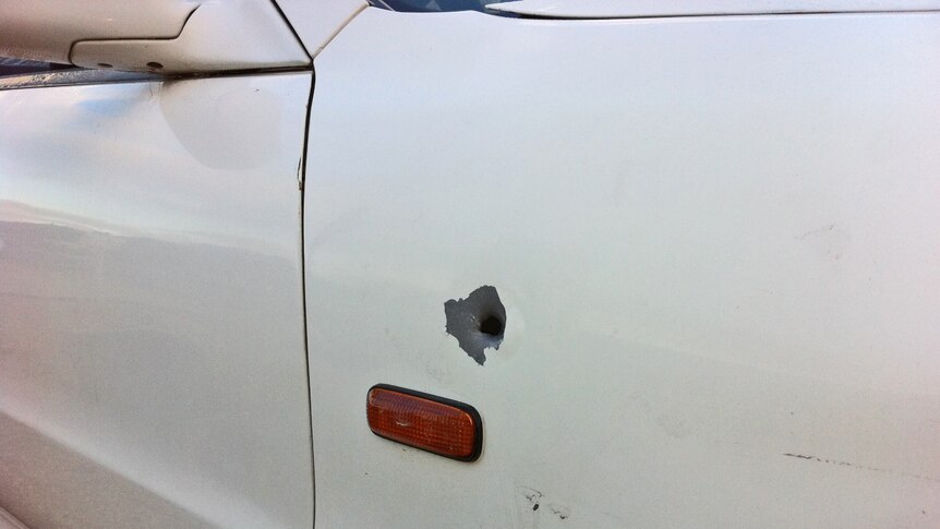Bullet hole in the side of a car which was shot at at Andrews Farm