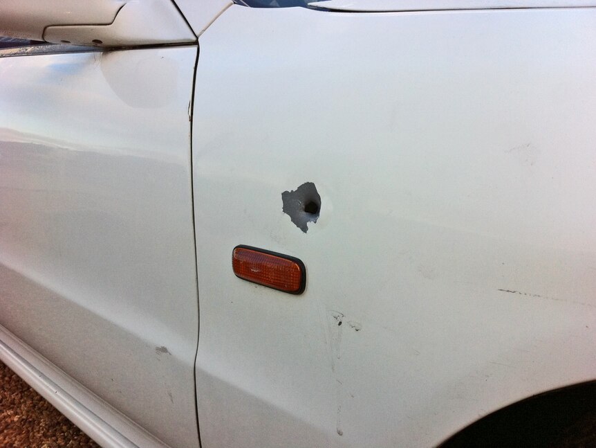 Bullet hole in the side of a car which was shot at at Andrews Farm