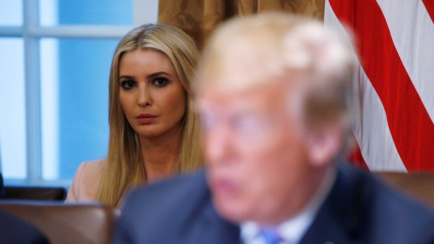 White House senior adviser Ivanka Trump listens as her father, US President Donald Trump.