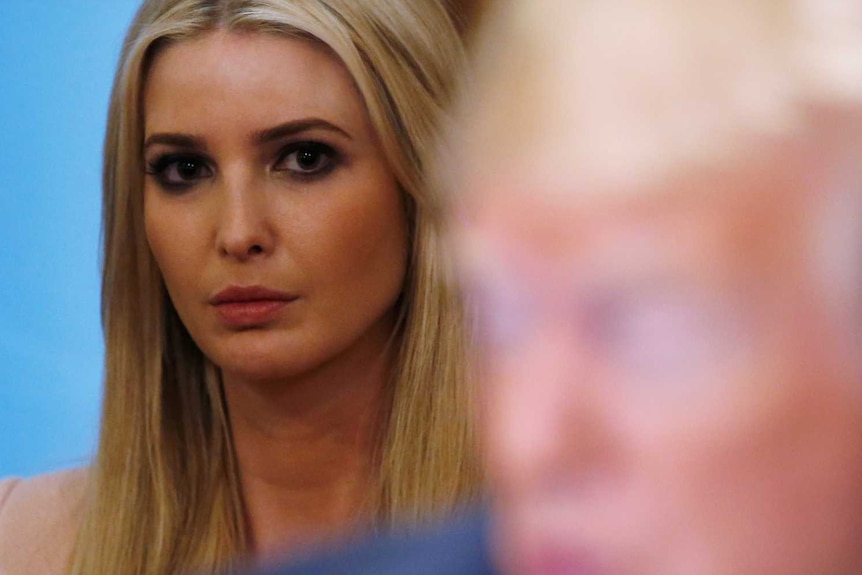 White House senior adviser Ivanka Trump listens as her father, US President Donald Trump.