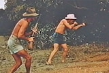 Two men shooting at crocodiles when hunting was legal.