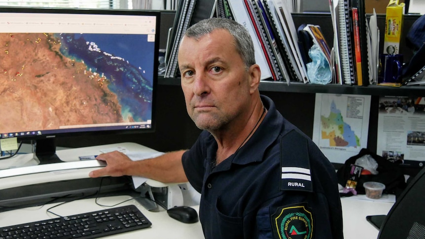 Rural Fire Service volunteer and Bushfire Safety Officer, Gordon Yorke, monitoring the Northern Region from his desk computer.
