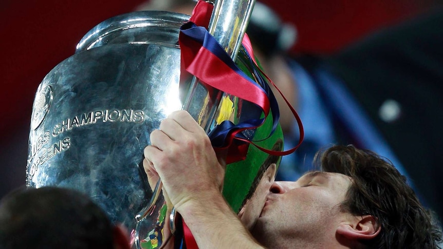 Barcelona's Lionel Messi kisses the trophy after their Champions League final win over Manchester United in London May 28, 2011