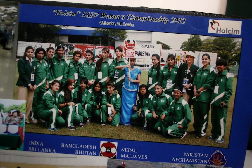 A view of a soccer team photo that includes Shahida Raza.