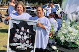 Emeline Tua (left) and Selamafi Tuitupou (right) came to pay their respects to family who died in a Logan house fire in 2011.