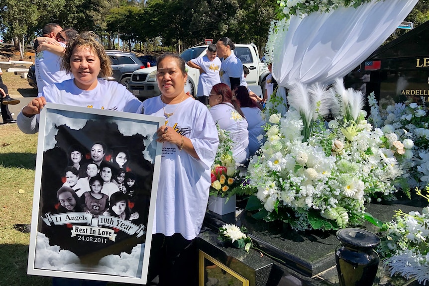 Emeline Tua (left) and Selamafi Tuitupou (right) came to pay their respects to family who died in a Logan house fire in 2011.