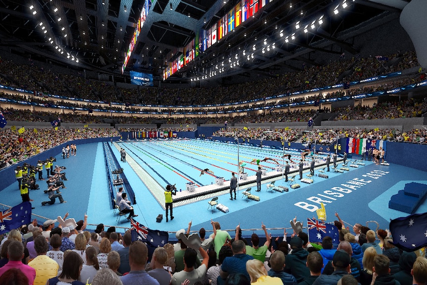 The inside of the swimming arena, showing the pool and crowds.