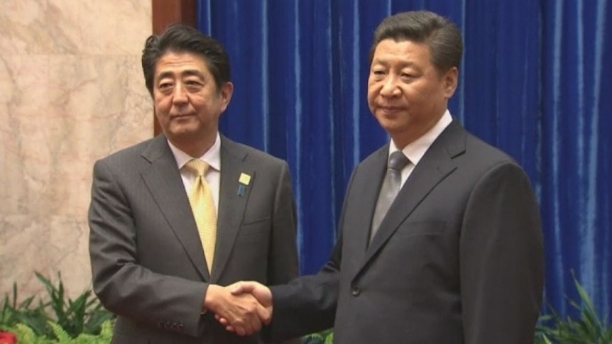 Frosty meeting between Xi Jinping and Shinzo Abe