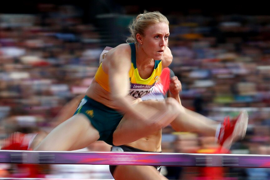 Sally Pearson competes in her women's 100m hurdles round 1 heat.