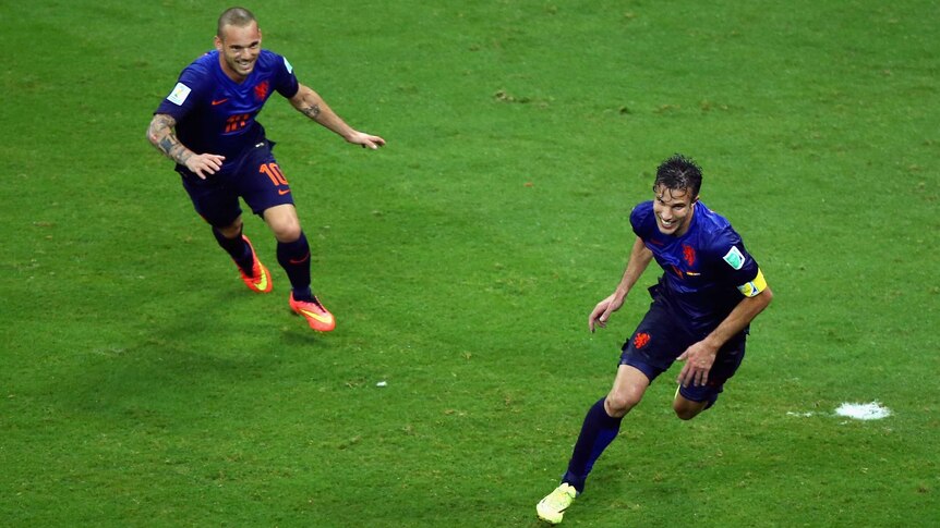 The Netherlands' Robin Van Persie (R) celebrates with team-mate Wesley Sneijder (L) against Spain.