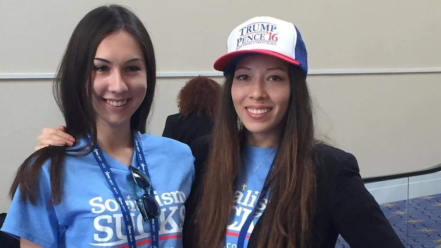Trump supporters wear shirts saying "socialism sucks"