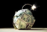 A bomb made of money with a lit fuse