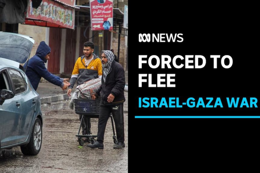Forced to flee, Israel-Gaza War: Three men walk to a car on a rainy street. One pushes a shopping cart full of belongings.