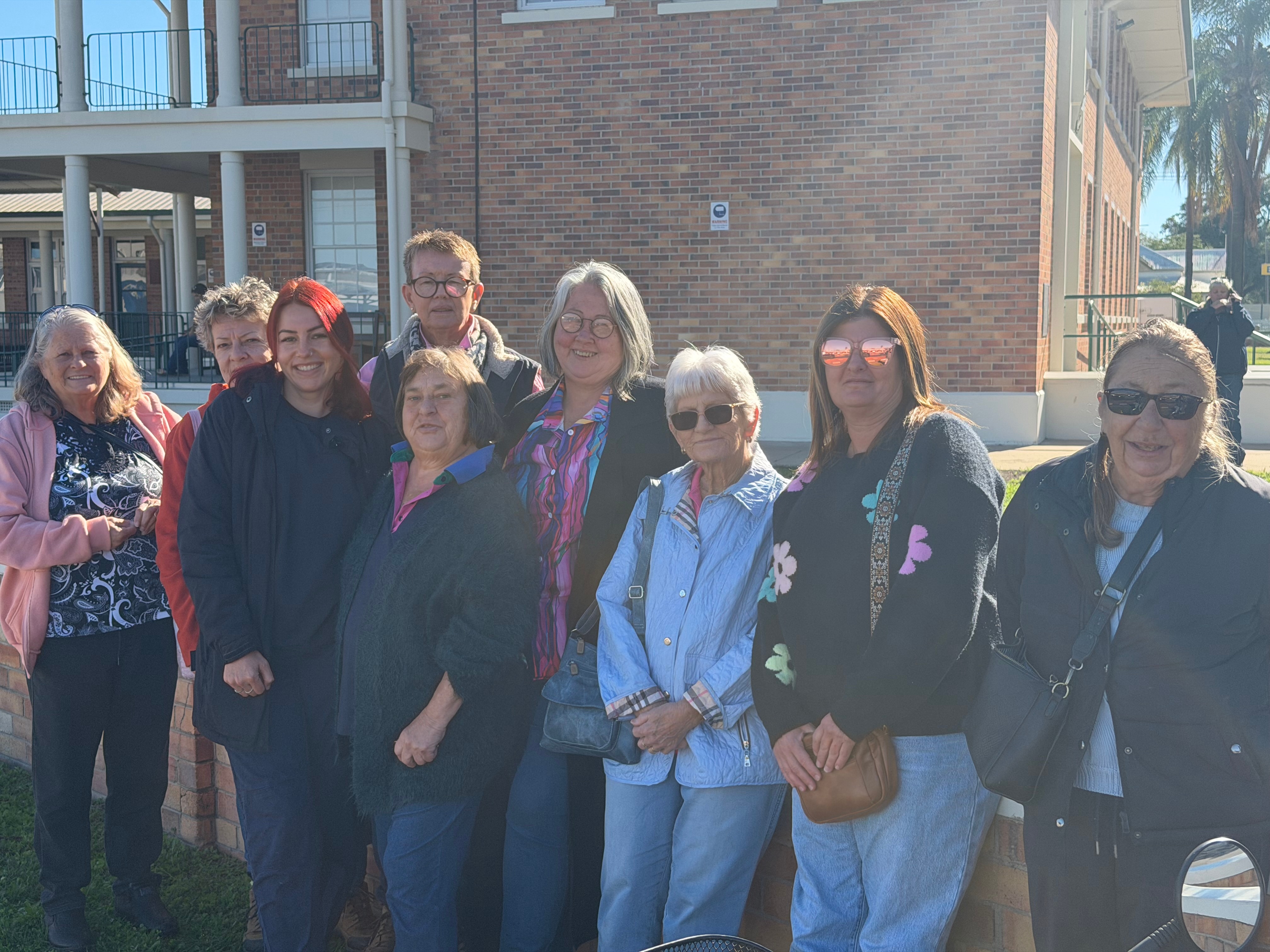 A group of people gathered out the front of the Goondiwindi Court House. 