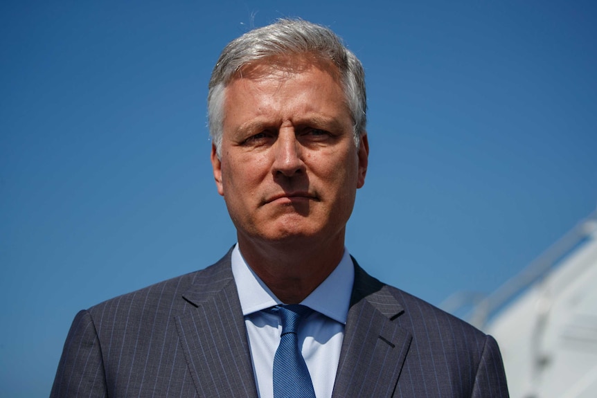 National security adviser Robert O'Brien stares forward wearing a suit and tie.