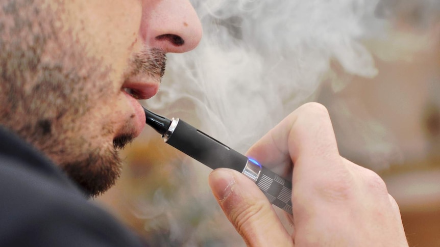 Close up of man using a vaping device