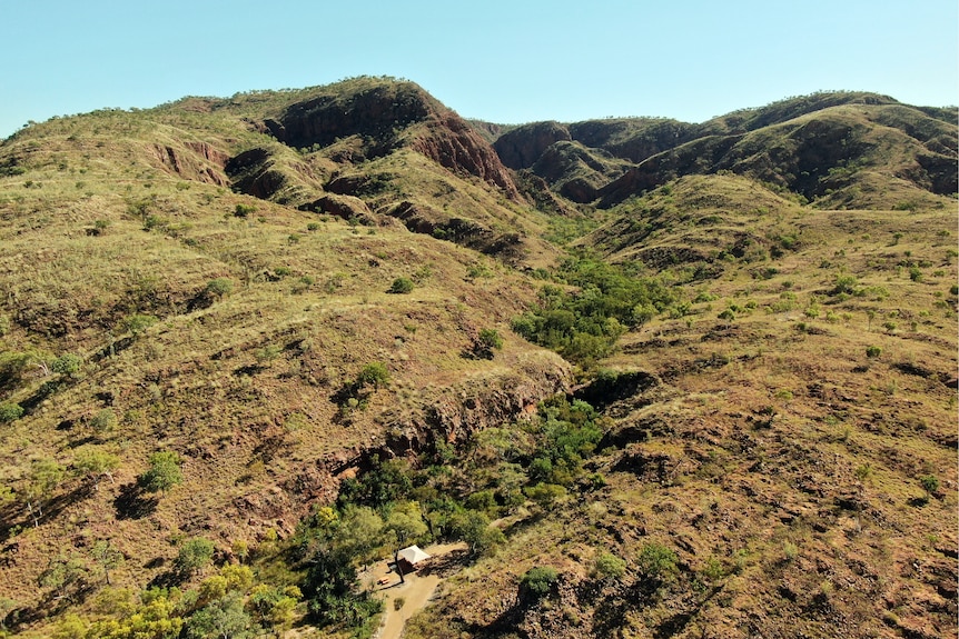 An aerial view of mountains with a small gorge.