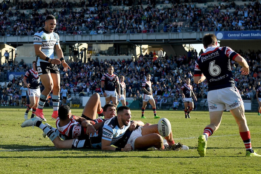 Jack Bird crosses against the Roosters