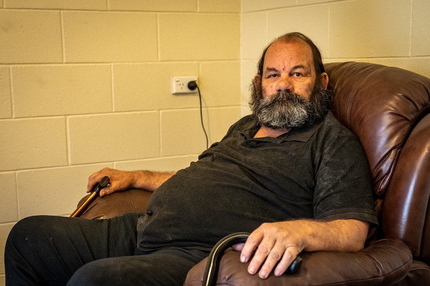 Gerald Friessbourg, a middle-aged man, sits in a recliner chair.