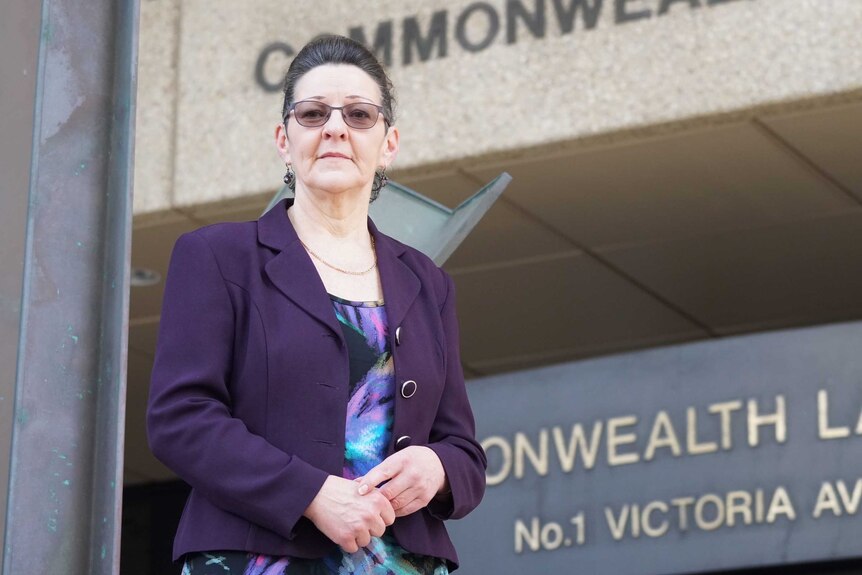 Noleen Hausler stands in front of a Perth court.