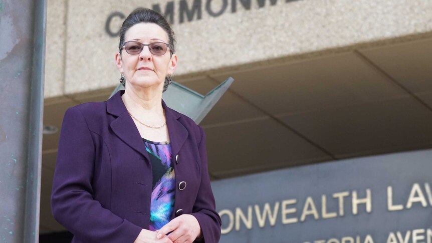 Noleen Hausler stands in front of a Perth court.