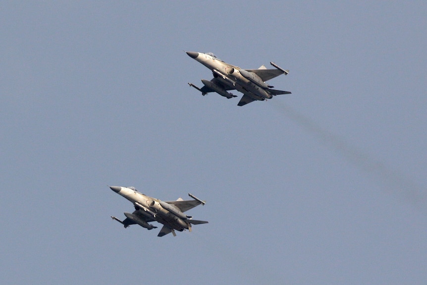 Two Taiwan Air Force fighter jets streak across the sky during a military drill in Taiwan, May 15, 2013.